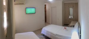 Postel nebo postele na pokoji v ubytování Hotel Tao