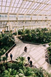 a group of people walking inside of a building at Beautiful West London House in London +4 photos