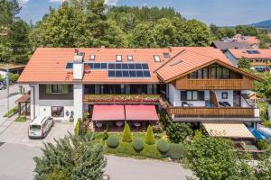 an aerial view of a house with solar panels on the roof at Hotel Sonnenspitz *** in Kochel