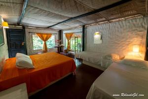 
Ein Bett oder Betten in einem Zimmer der Unterkunft Hotel Taironaka Turismo Ecológico y Arqueología
