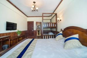 Postel nebo postele na pokoji v ubytování Memory Inn Guilin Central
