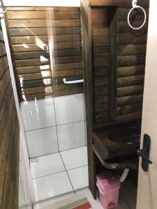 a bathroom with a shower with a toilet at Cabanas MFK in Machadinho