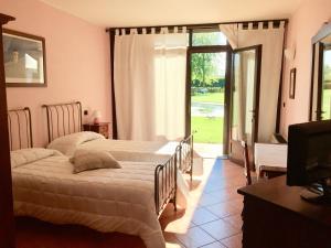 Postel nebo postele na pokoji v ubytování Albergo Cosmera