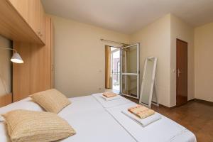 Postel nebo postele na pokoji v ubytování Apartments & Rooms Beus