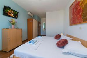 Postel nebo postele na pokoji v ubytování Apartments & Rooms Beus