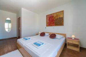Postel nebo postele na pokoji v ubytování Apartments & Rooms Beus