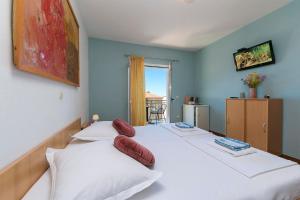 Postel nebo postele na pokoji v ubytování Apartments & Rooms Beus