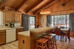 a kitchen and dining room with a table and chairs at 69 Bordentown West in Wawona