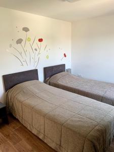 A bed or beds in a room at Les Terrasses de l'Océan