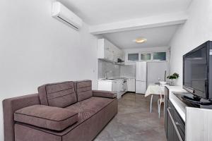 Kuchyň nebo kuchyňský kout v ubytování Apartmani Nikola