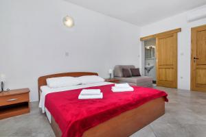 Postel nebo postele na pokoji v ubytování Apartmani Nikola