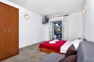 Postel nebo postele na pokoji v ubytování Apartmani Nikola