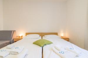 Posteľ alebo postele v izbe v ubytovaní Apartments Coronata