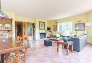 a living room with a couch and a table at Jaza Paraiso in Cercedilla