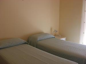 Postel nebo postele na pokoji v ubytování Albergo Villa Nobile