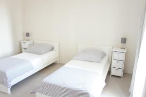 En eller flere senge i et værelse på Days@Sea