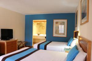 Voodi või voodid majutusasutuse Hotel Colonial Ciudad Juarez toas