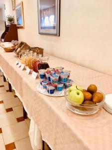 a table topped with plates of food and drinks at Hotel Villa Edelweiss in Chianciano Terme