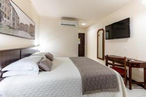 
Cama ou camas em um quarto em Aguas do Iguaçu Hotel Centro
