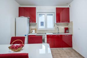 A kitchen or kitchenette at Apartments Adriatic - Split Stobrec