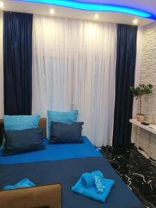 A bed or beds in a room at TOTANI LUX