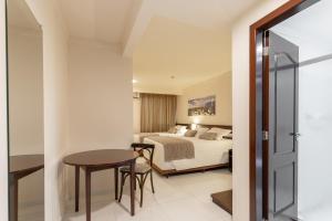 Cama ou camas em um quarto em Bogari Hotel