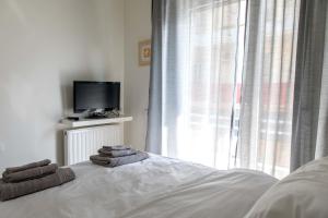 Letto o letti in una camera di The Corner Suite in Historical Center