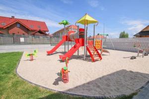 a playground with a slide and a slideintend at Baltic Pearl in Ustka