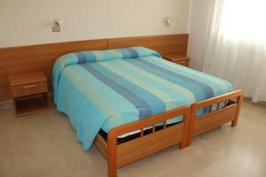 Letto o letti in una camera di Hotel Caravel