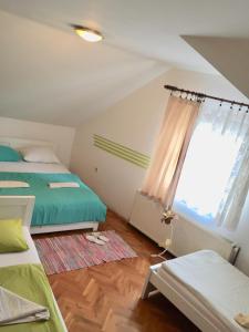 Postel nebo postele na pokoji v ubytování Hostel Lega House