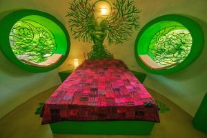 a table in a room with two stained glass windows at Green Moon Lodge in Montezuma