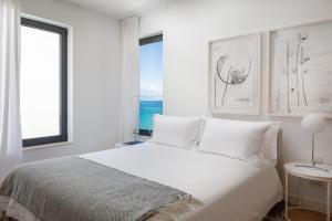 Postel nebo postele na pokoji v ubytování Agapao Villas + 37 fotografií