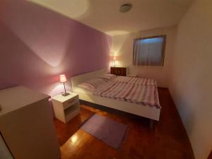 Posteľ alebo postele v izbe v ubytovaní Apartman Fiorini Zofija