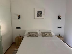 Postel nebo postele na pokoji v ubytování Apartamento Somos Ainsa