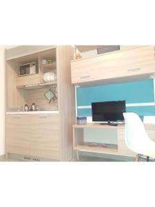 A kitchen or kitchenette at Island Apartment Porto Cesareo