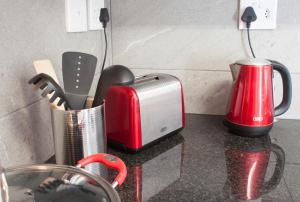 a kitchen counter with a toaster and a toaster at 9a@Crassula Way in Cape Town