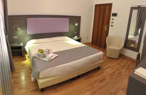 Voodi või voodid majutusasutuse Hotel Settentrionale Esplanade toas
