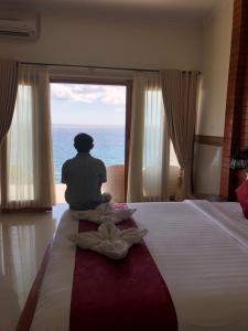 Ein Bett oder Betten in einem Zimmer der Unterkunft Ogix Cliff Paradise