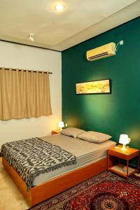 Кровать или кровати в номере Terima Kasih