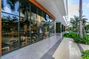 a store front of a shopping mall with glass windows at RiverGate Residence in Ho Chi Minh City