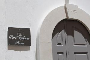 a sign on the side of a building with a door at Sant'Eufemia Rooms Self Check in in Vieste