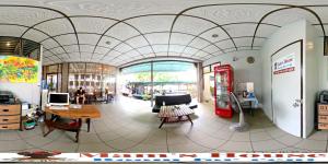 a large room with a coke machine and a table at Mam's House Khaosan in Bangkok