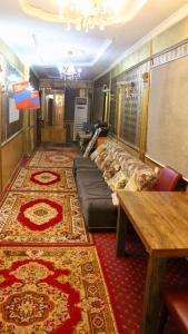 a living room with a couch and a table at City Hostel & Tours in Ulaanbaatar