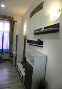 a kitchen with a white sink and white cabinets at Modern Central-Near Unirii Square in Cluj-Napoca