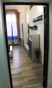 a kitchen with a door open and a window at Modern Central-Near Unirii Square in Cluj-Napoca