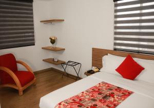 Ein Bett oder Betten in einem Zimmer der Unterkunft Hotel Portal Del Norte