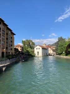 a view of a river in a city with buildings at L'Appart du Thiou - Au coeur d'Annecy avec Garage in Annecy