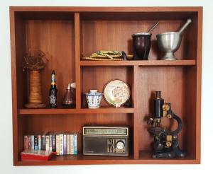 a book shelf with a radio and other items on it at San Bu strolling in Tainan