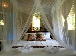 Katil atau katil-katil dalam bilik di Nypa Style Resort Camiguin