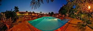 a large swimming pool in a resort at night at Agriturismo Gianferrante in Paterno